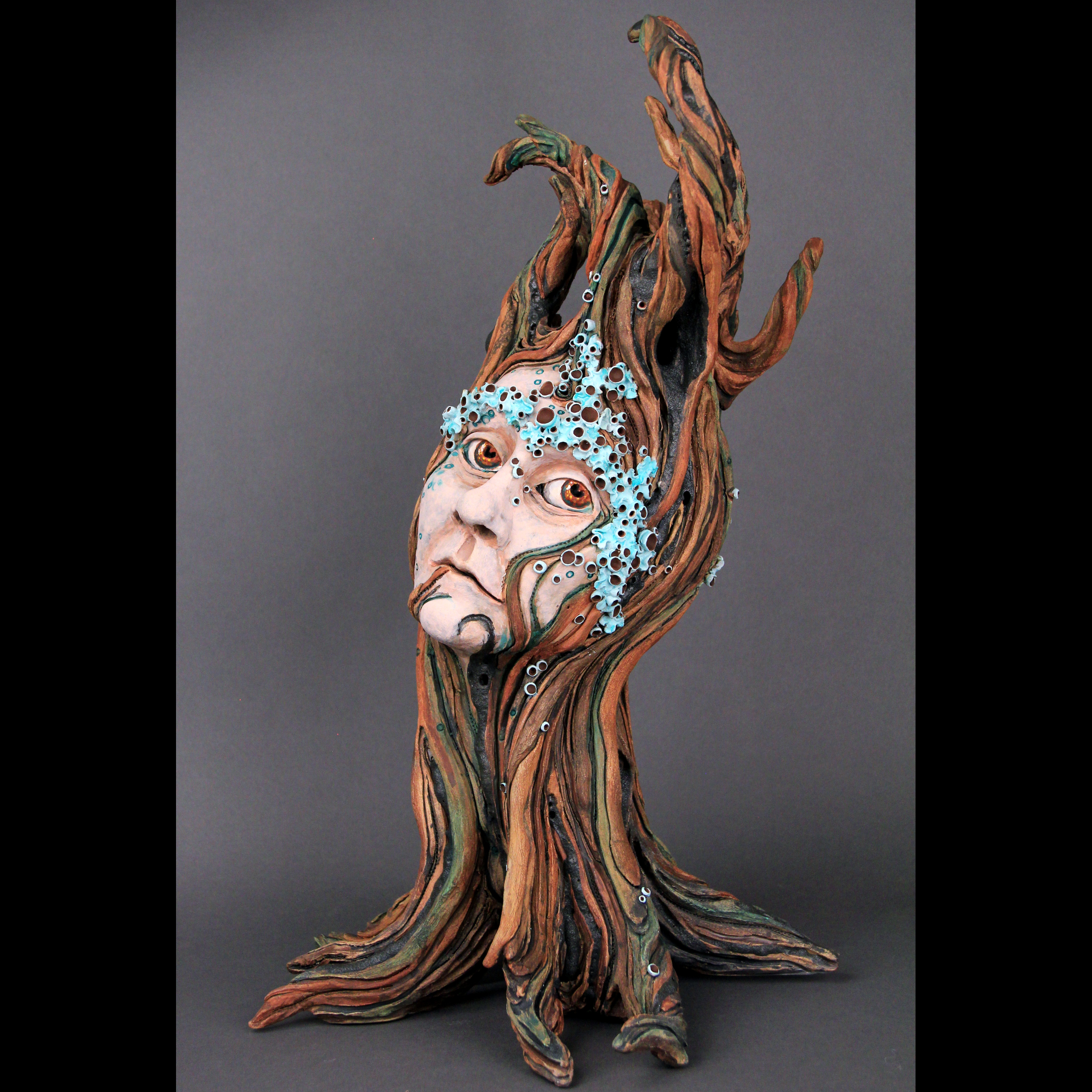 ceramic sculpture of a tree lady in deep thought